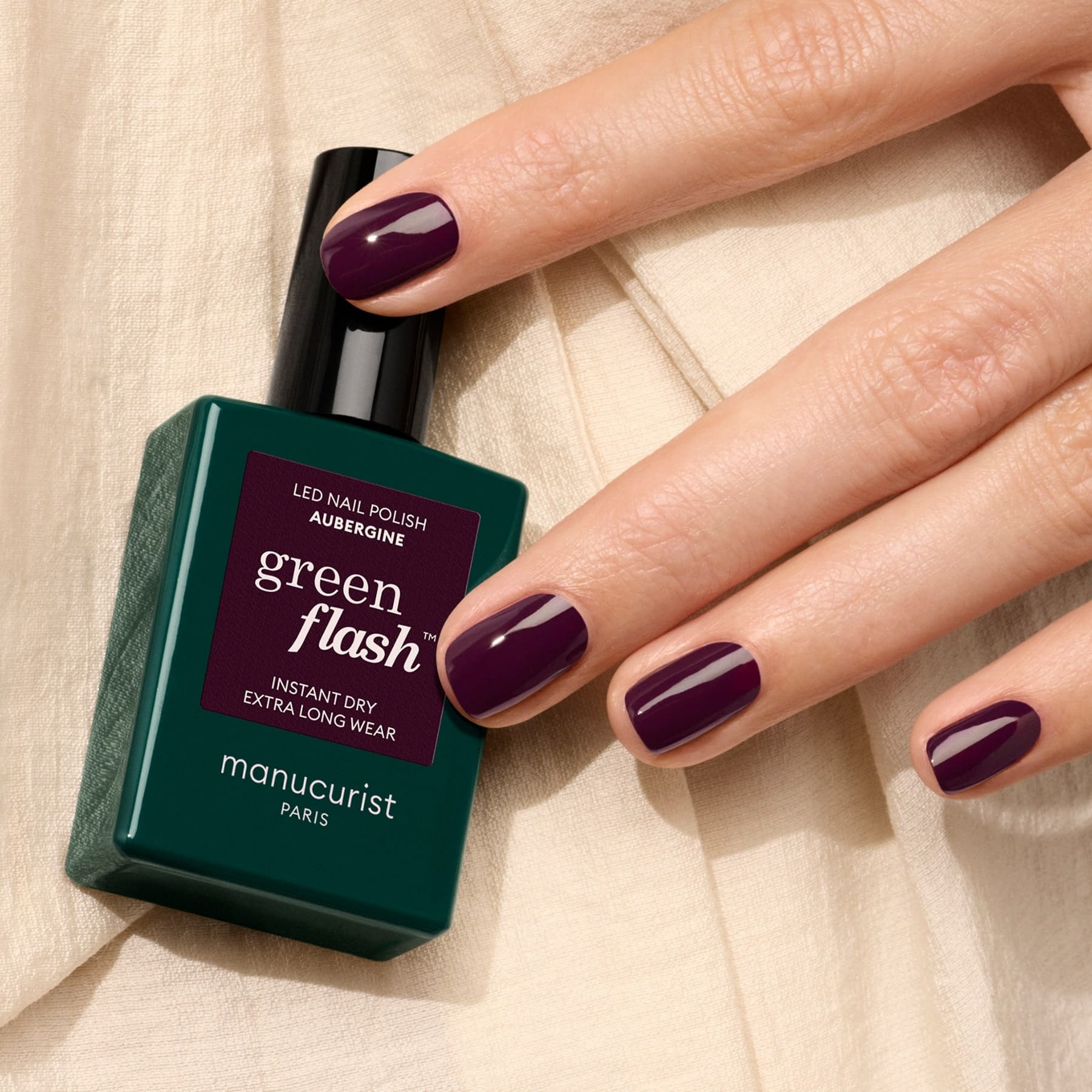 Manicurist aubergine nails